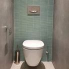 The Sevilla Mosaic Tiles, Original KitKat design in a turquoise, with a size of 20x145mm. Installed on the wall behind the toilet in a bathroom