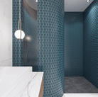 The Sevilla Mosaic Tiles, Oval design in Azure Blue, with a size of 23x98mm. Installed on a curved wall shower area within a bathroom. The corner of a vanity unit in front to the left.